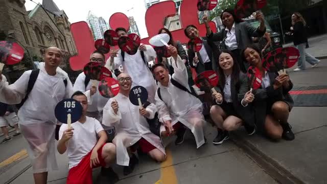 The Bargain premiere crowd gathered outside with red fans